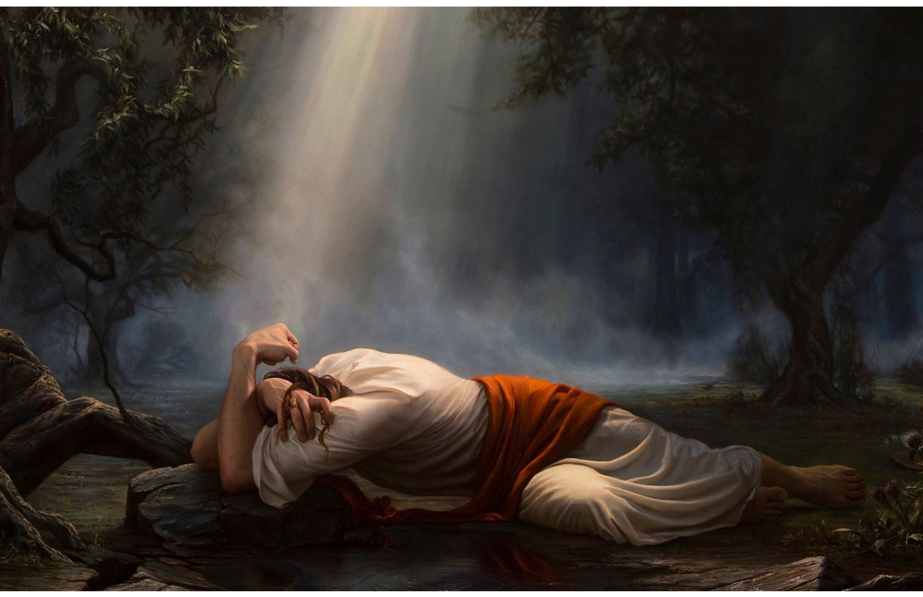 Christ prostrate in the Garden of Gethsemane, a beam of heavenly light shining upon Him
